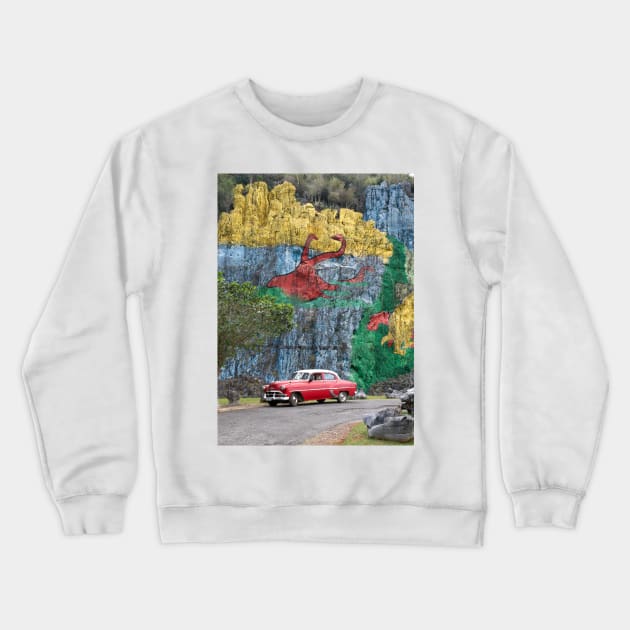 Vintage cars in front of the Mural de la Prehistoria in Cuba Crewneck Sweatshirt by Offiinhoki